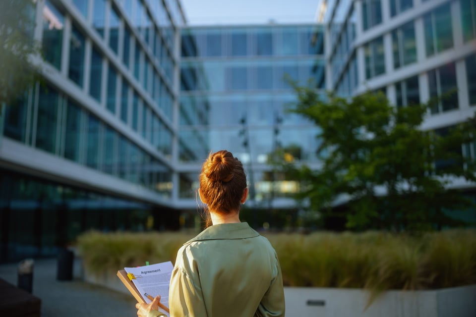 woman-standing-outside-office-building